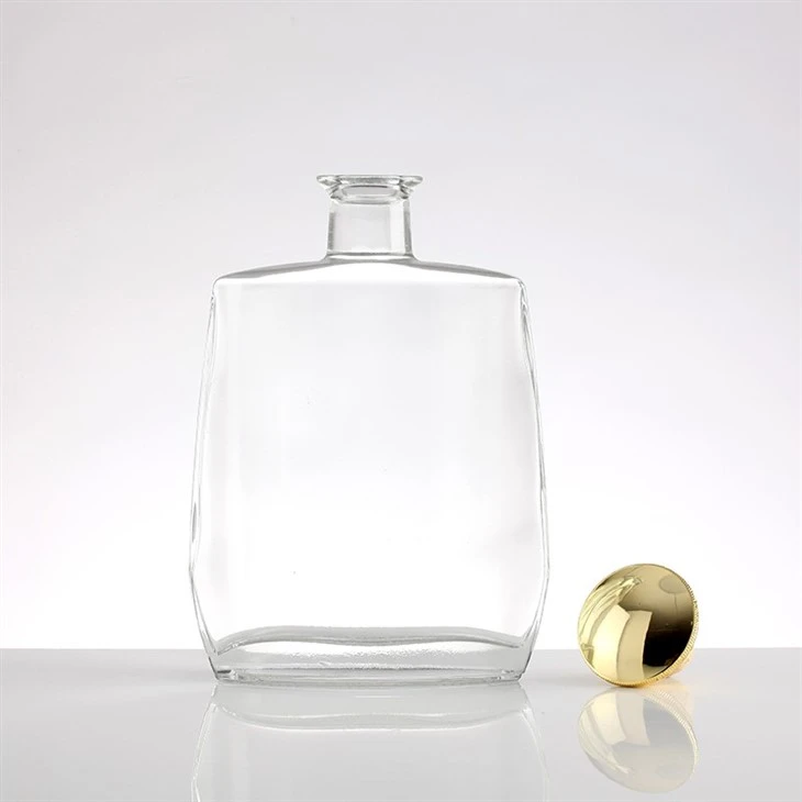 Simple Golden-Lidded Transparent Glass Bottle